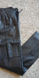 Brand new in a pack leather pants, side zipper, dress cut